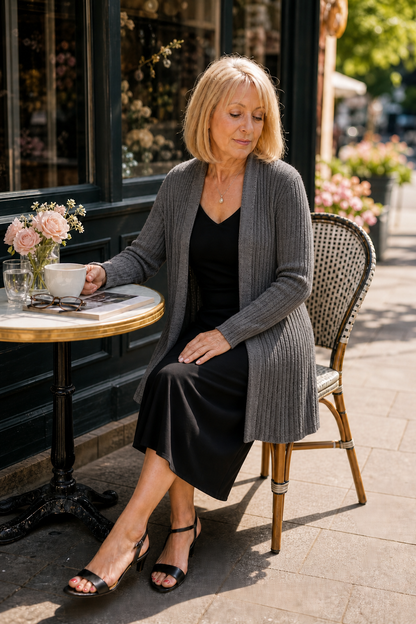 Woman at an outdoor cafe in a charcoal waterfall ribbed cardigan