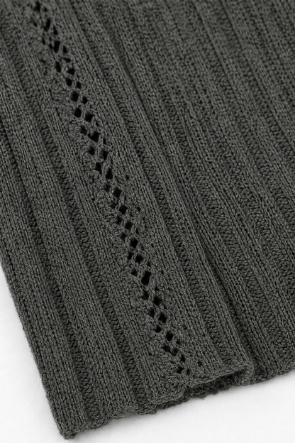 Pointelle trim detail on the front edge of a charcoal cardigan