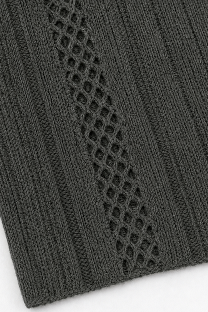 Open diamond mesh panel in a charcoal ribbed cardigan