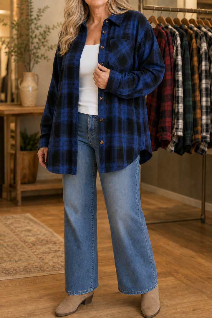 Woman on an autumn path in a red buffalo plaid shacket