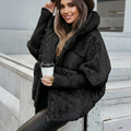Black oversized quilted hooded jacket with a faux fur lined hood