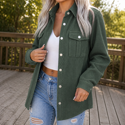 Green wide wale corduroy shirt jacket worn open over a white top