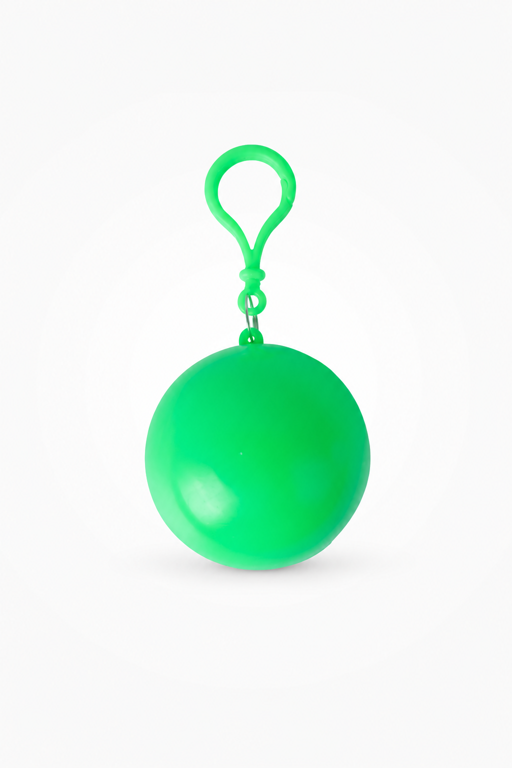 Green packable rain poncho in a ball shaped case with a clip