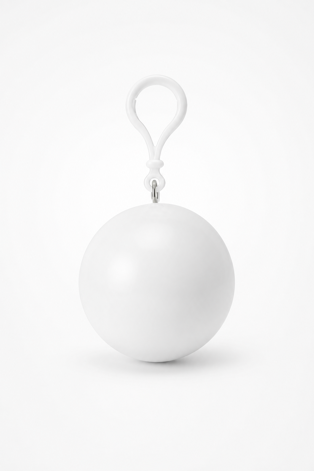 White packable rain poncho in a ball shaped case with a clip