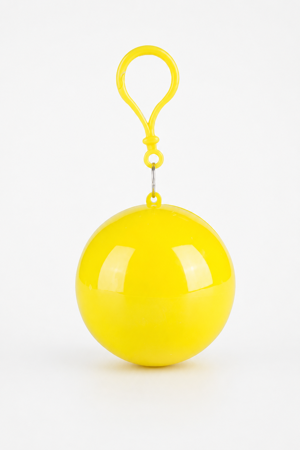 Yellow packable rain poncho in a ball shaped case with a clip