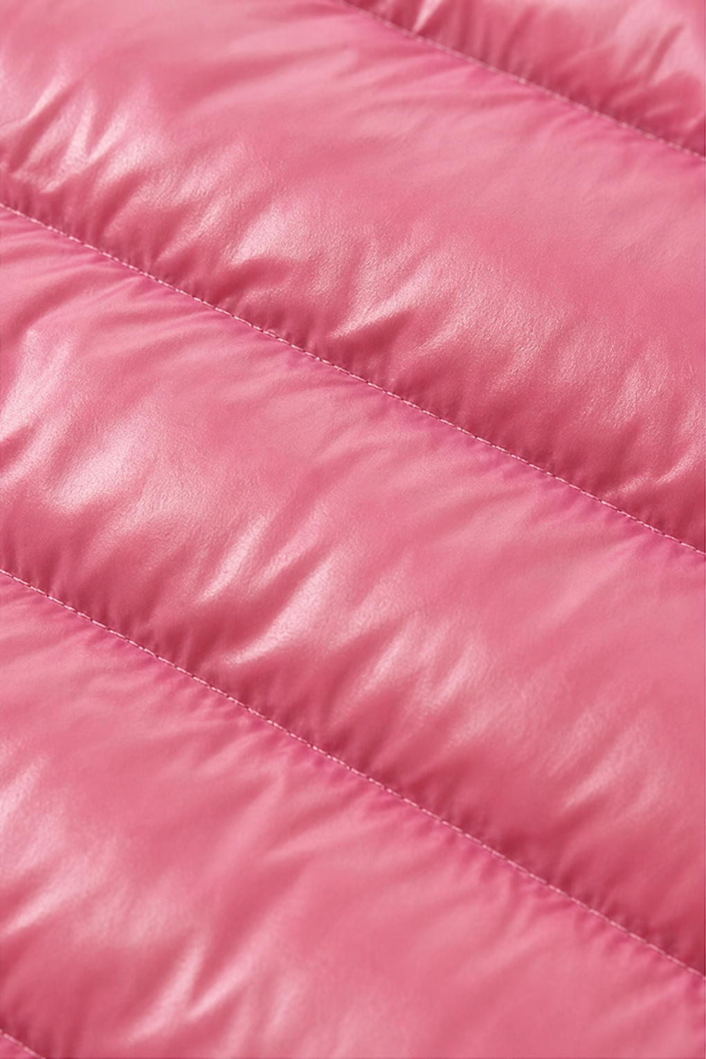 Close up of the horizontal quilted channels on a pink puffer