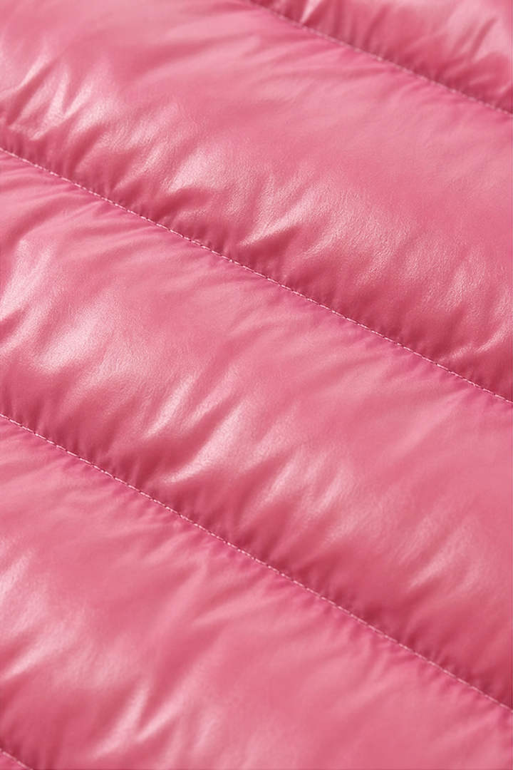 Close up of the horizontal quilted channels on a pink puffer