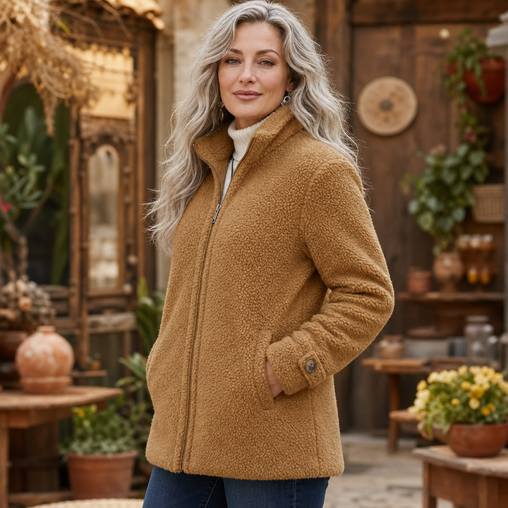 Woman in a courtyard shop in a camel plush fleece jacket