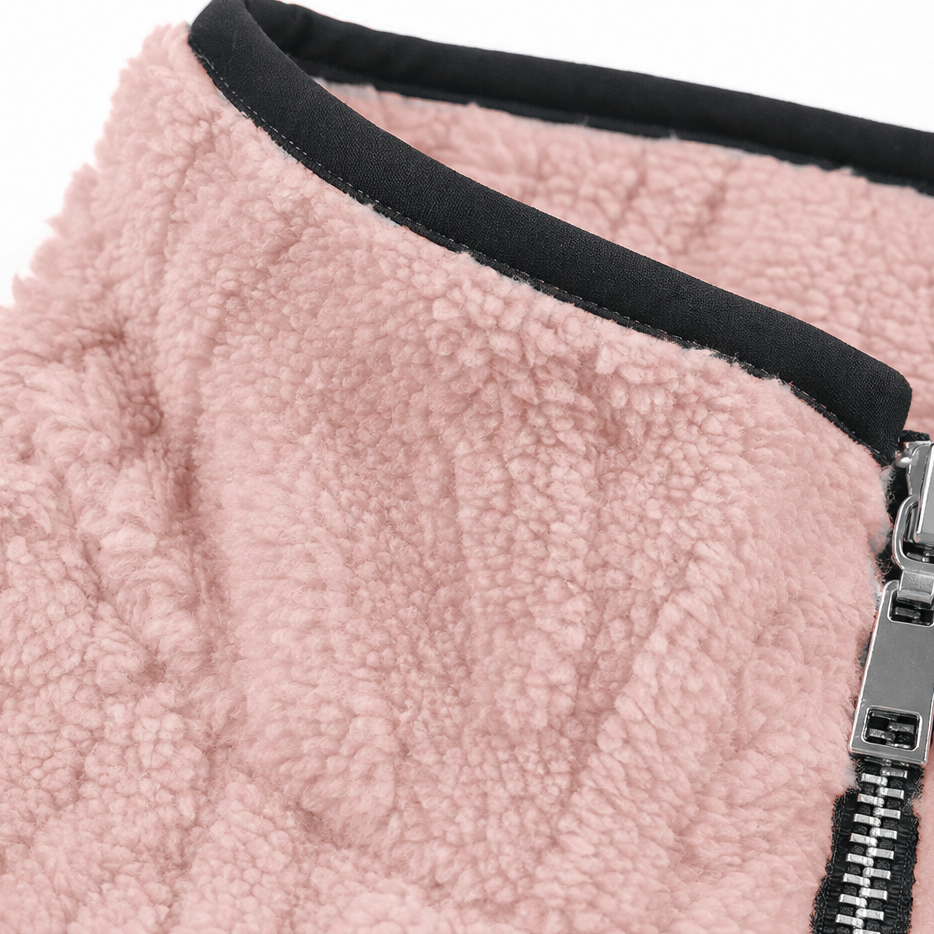 Black bound collar edge on a pink plush fleece pullover