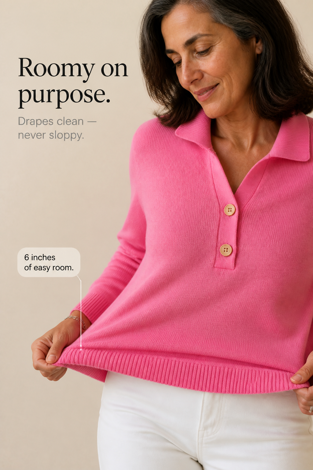Pink polo collar knit sweater with a relaxed fit, hem held out to show the room