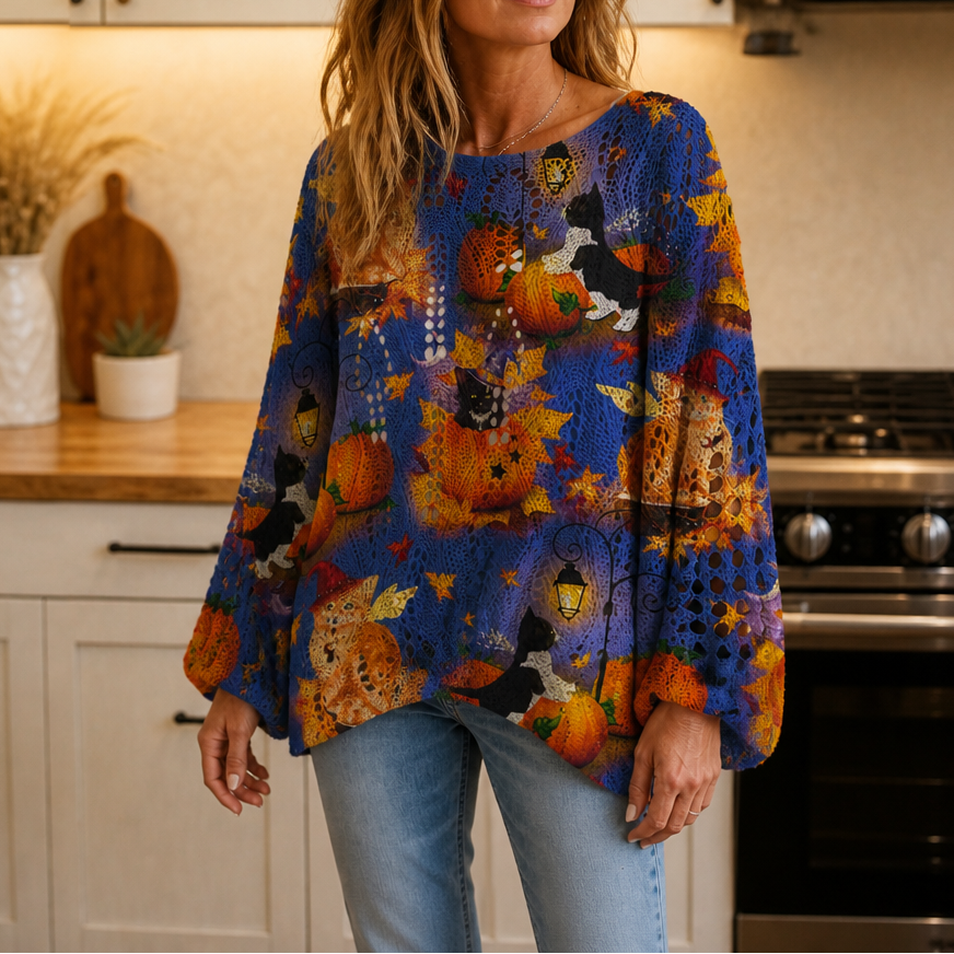 Blue long sleeve top with an all over print of pumpkins, cats and autumn leaves