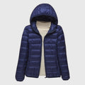 Navy lightweight quilted puffer jacket with a hood, flat lay