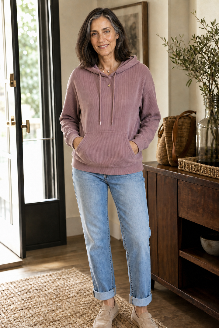 Mauve ribbed corduroy hoodie worn with rolled jeans, full length