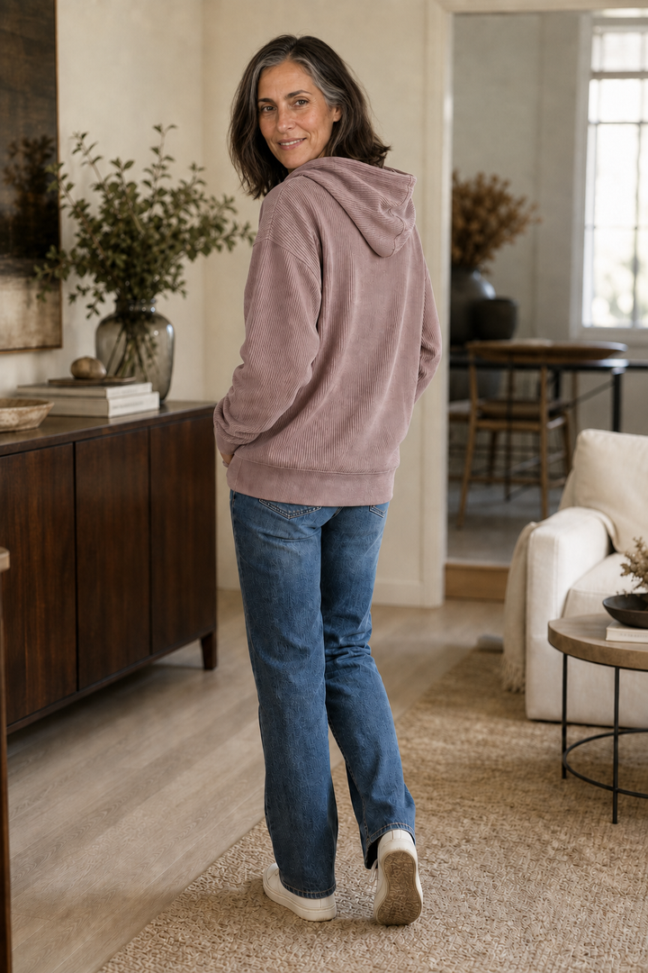Back view of a mauve ribbed corduroy look hoodie with the hood down