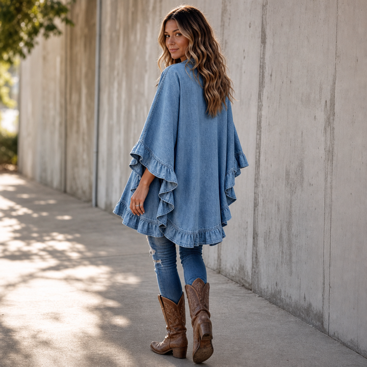Back view of a denim ruffle cardigan with western boots