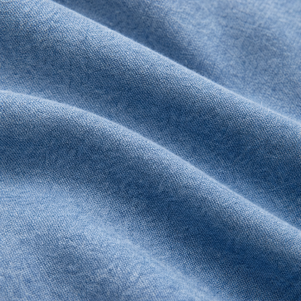 Close up of the soft washed denim fabric in folds