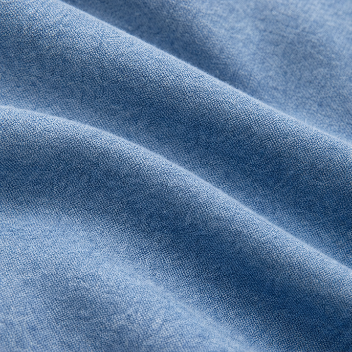 Close up of the soft washed denim fabric in folds