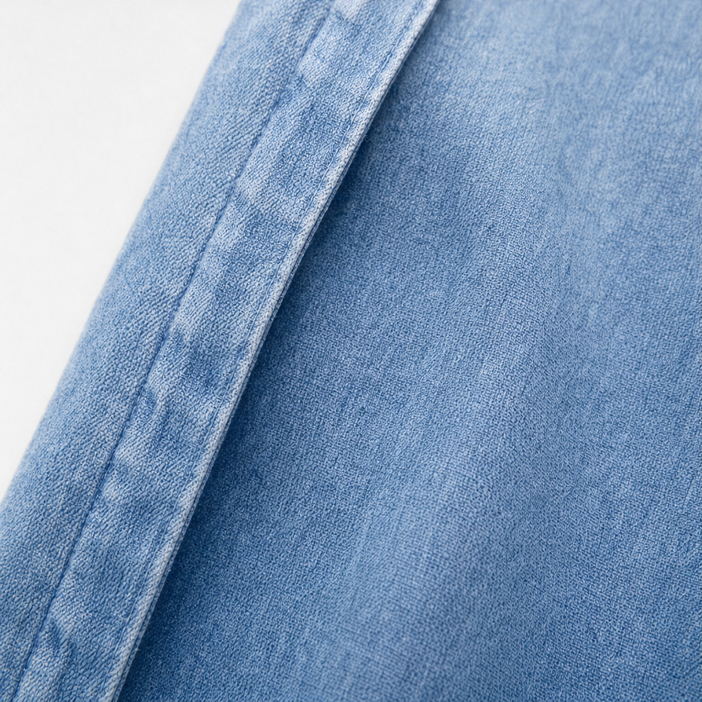 Front edge and stitching detail on a denim ruffle cardigan