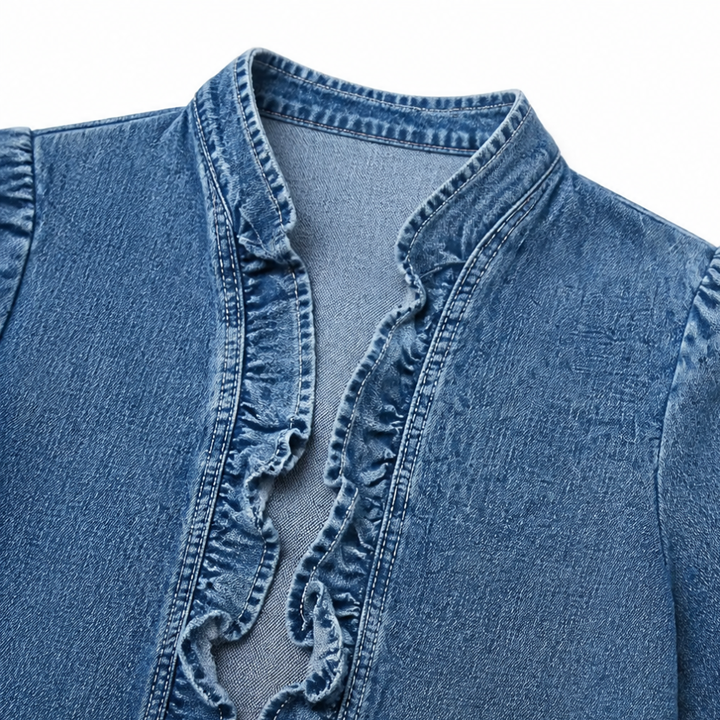 Close up of the ruffled front edge and stand collar in denim