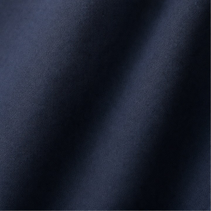 Close up of the smooth navy windbreaker fabric