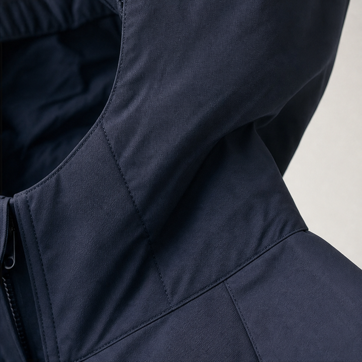 Close up of the hood and zip on a navy windbreaker