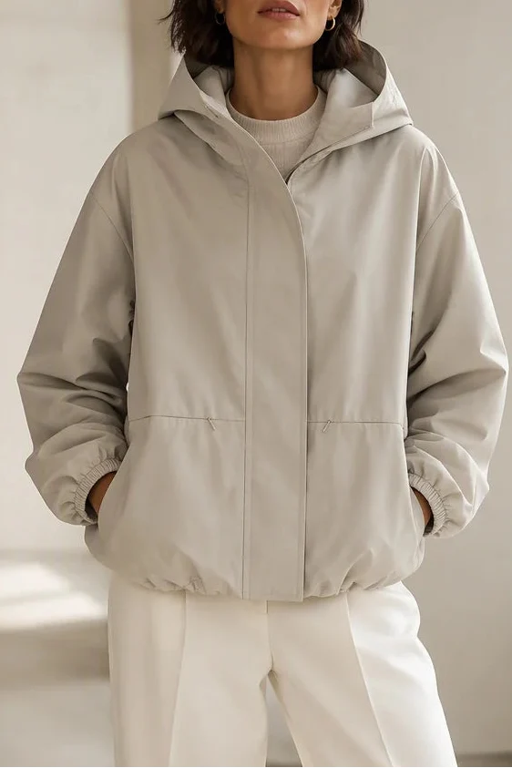 Stone hooded windbreaker with a sculpted balloon hem