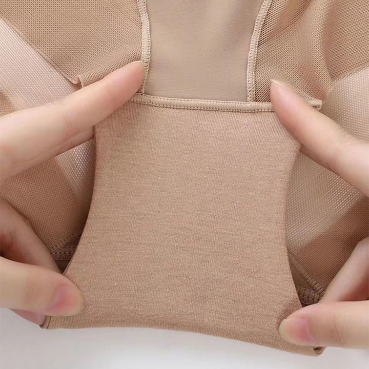 Hands stretching the cotton gusset of nude briefs