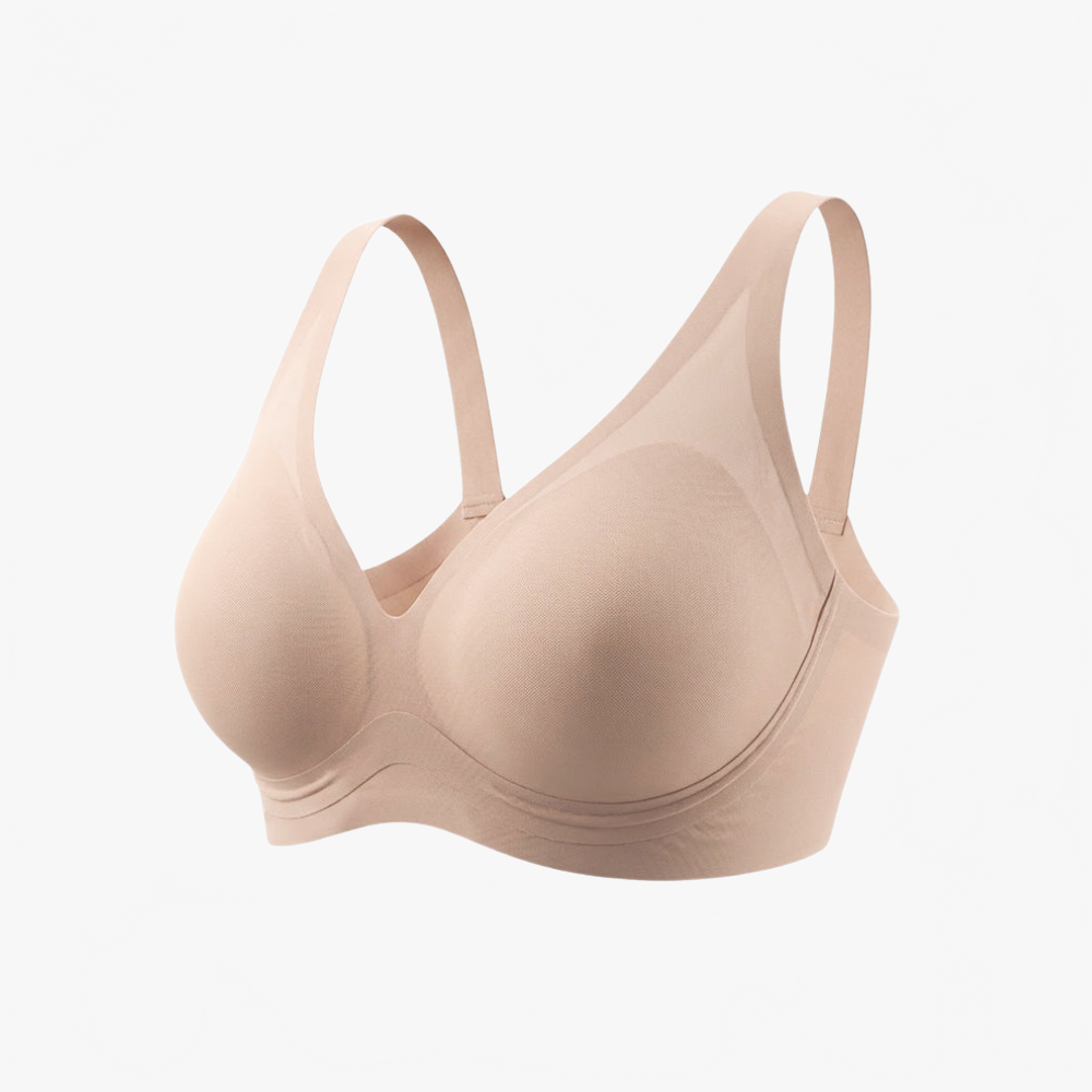 Nude deep-V wireless bra shown at an angle on white