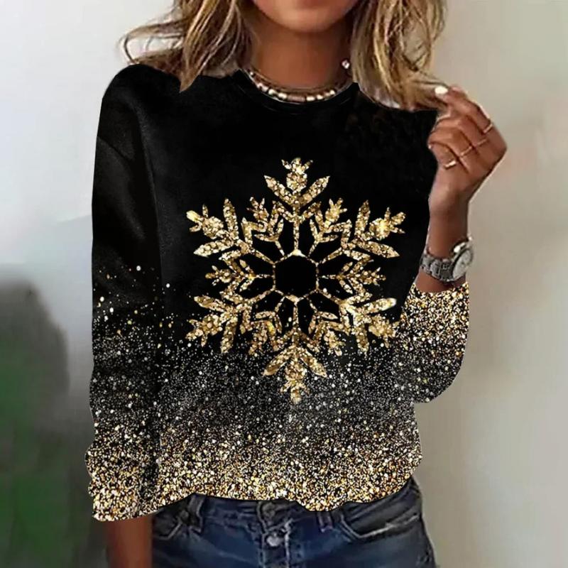 Black knit sweater with a gold sequin snowflake and glitter hem