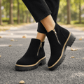Black suede chelsea boots with side zips and lug soles