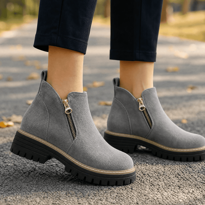 Grey suede chelsea boots with gold side zips and lug soles