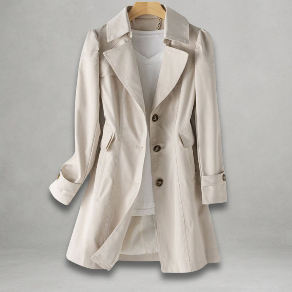 Ivory notch lapel trench coat on a hanger with buttoned cuff tabs