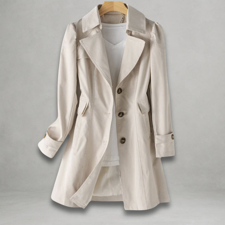 Ivory notch lapel trench coat on a hanger with buttoned cuff tabs