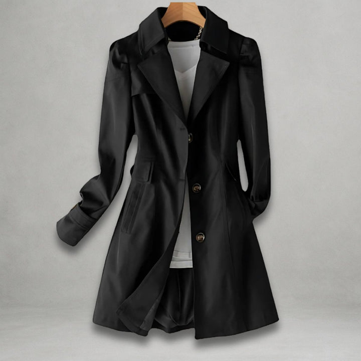 Black notch lapel trench coat on a hanger with buttoned cuff tabs