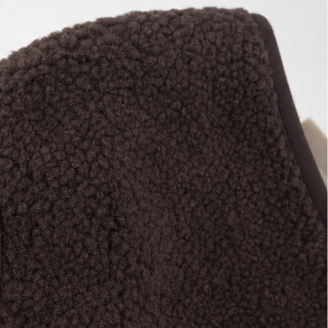 Boxy shoulder and bound edge on a brown teddy fleece vest