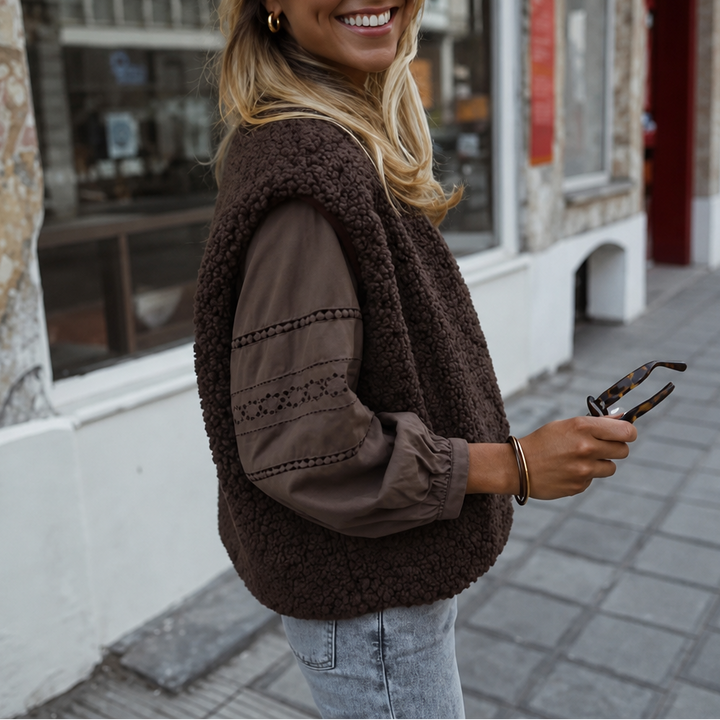 Brown teddy fleece sleeveless vest worn over a brown shirt