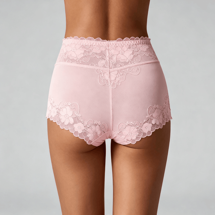 Back view of light pink floral lace high-waist briefs worn by a model