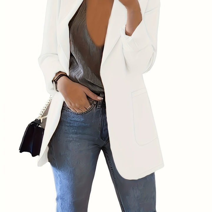 White tailored longline blazer worn open over jeans