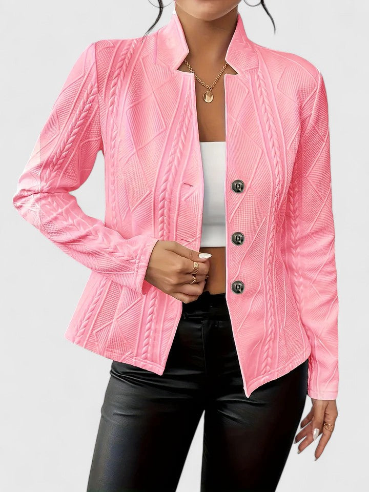Pale pink cable textured stand collar jacket over a white top