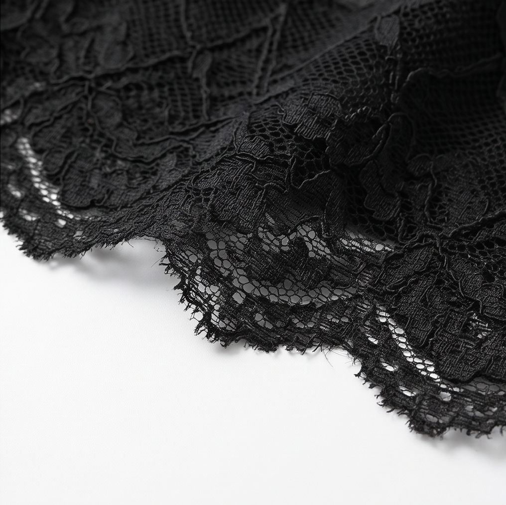 Scalloped black lace hem on the peplum cami