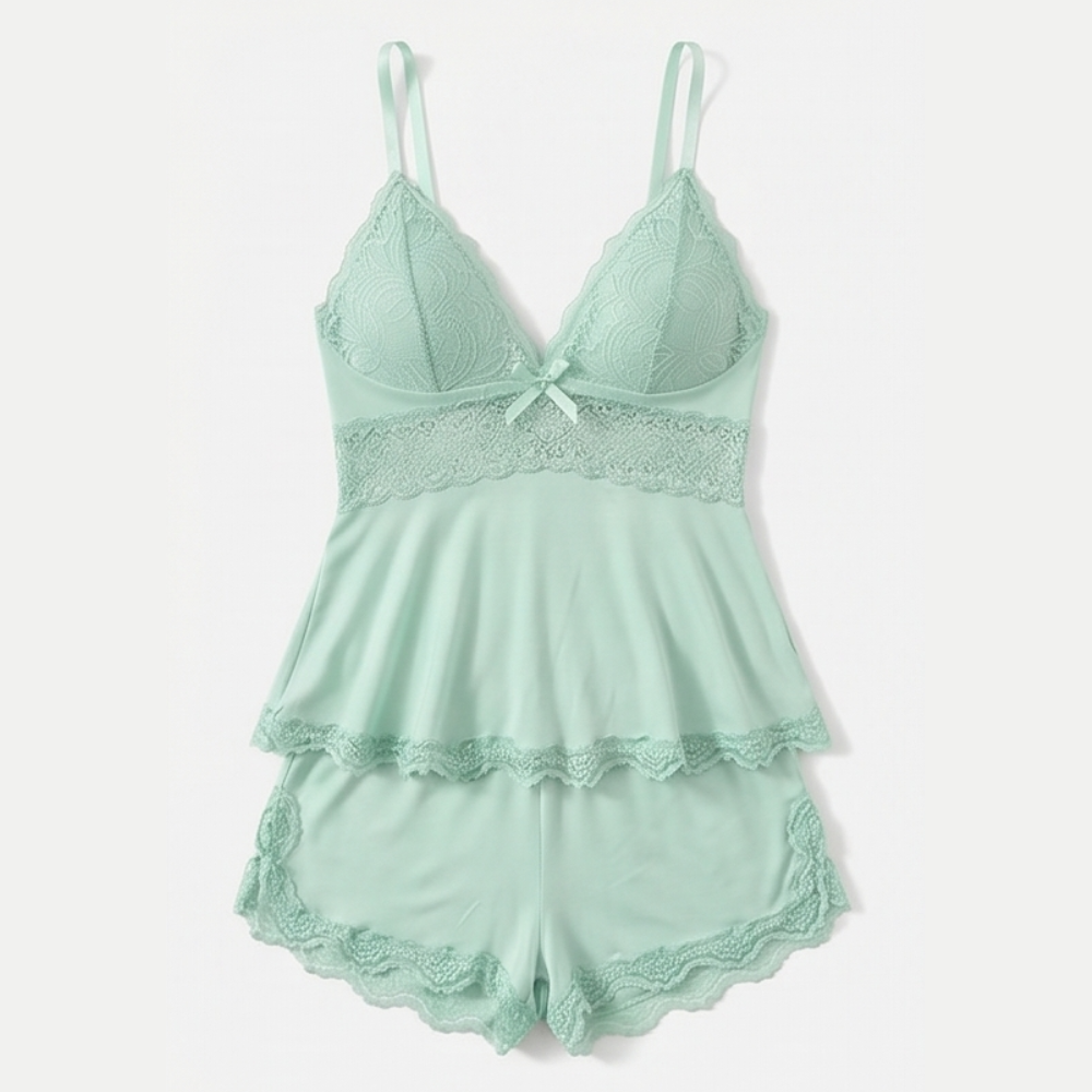 Mint green lace peplum cami and shorts set laid flat
