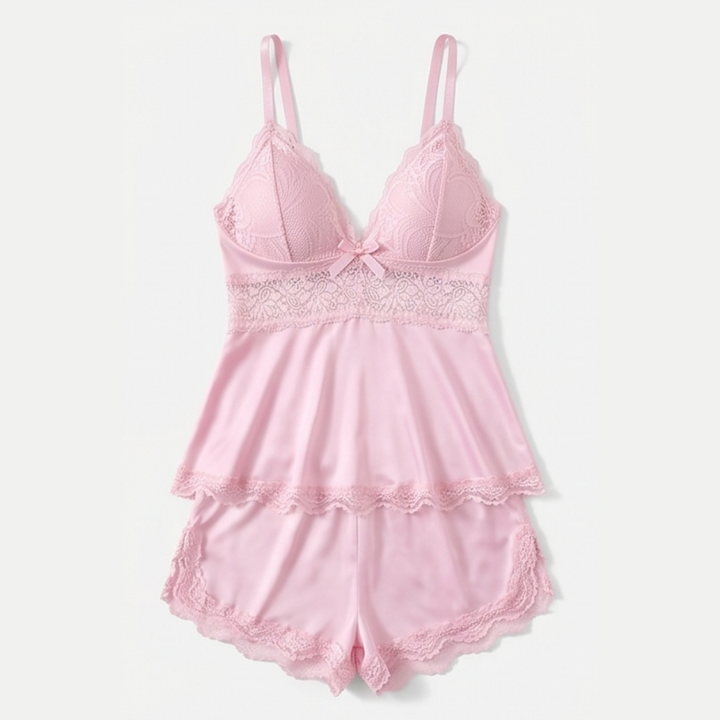 Pink lace peplum cami and shorts set laid flat