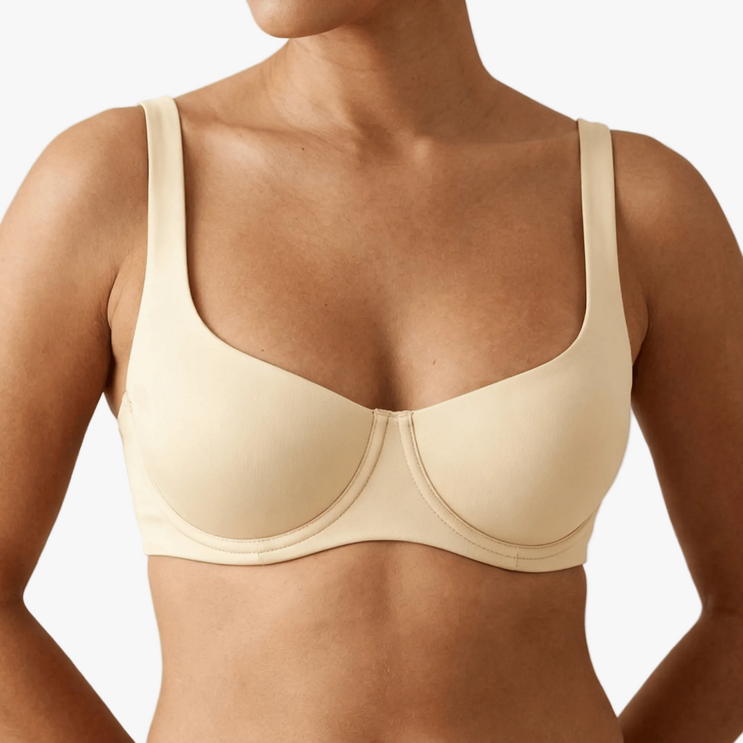 Ivory unlined balconette bra worn on a body