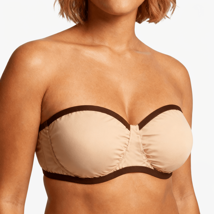 Nude strapless bra with a contrast dark trim