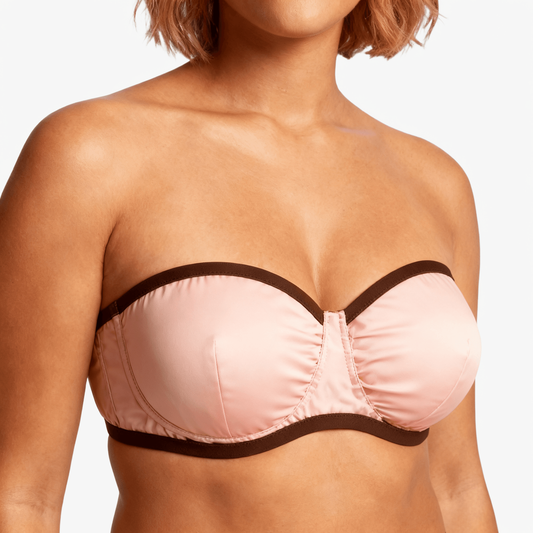 Pink strapless bra with a contrast dark trim