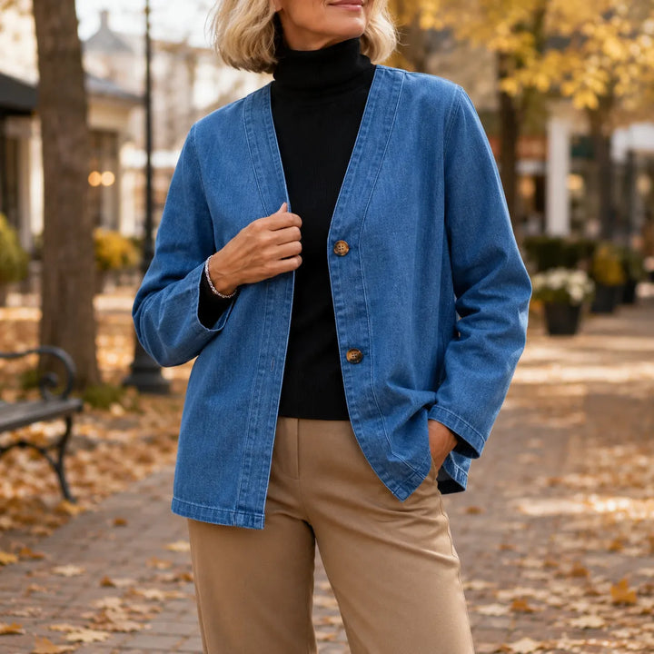 Blue denim look jacket with a collarless V neck and buttons