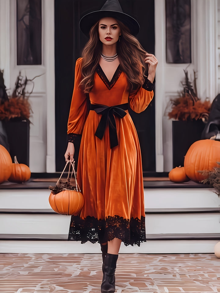 Orange velvet midi dress with black lace trim, a V neck and a tie waist