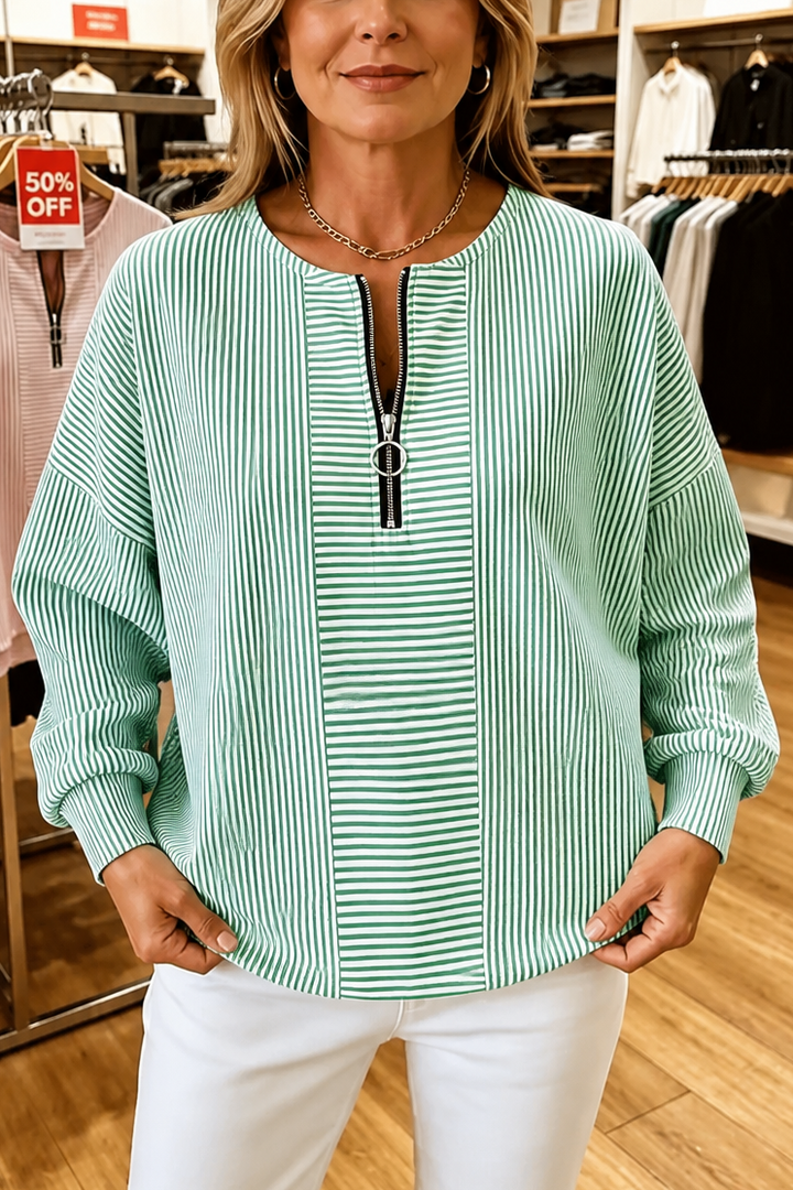 Green striped quarter zip top with a contrast front panel
