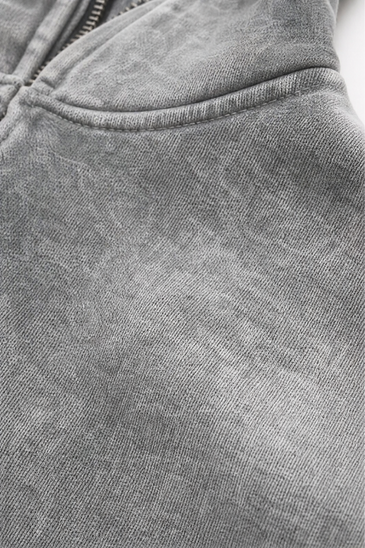 Close up of the washed grey fleece and pocket seam