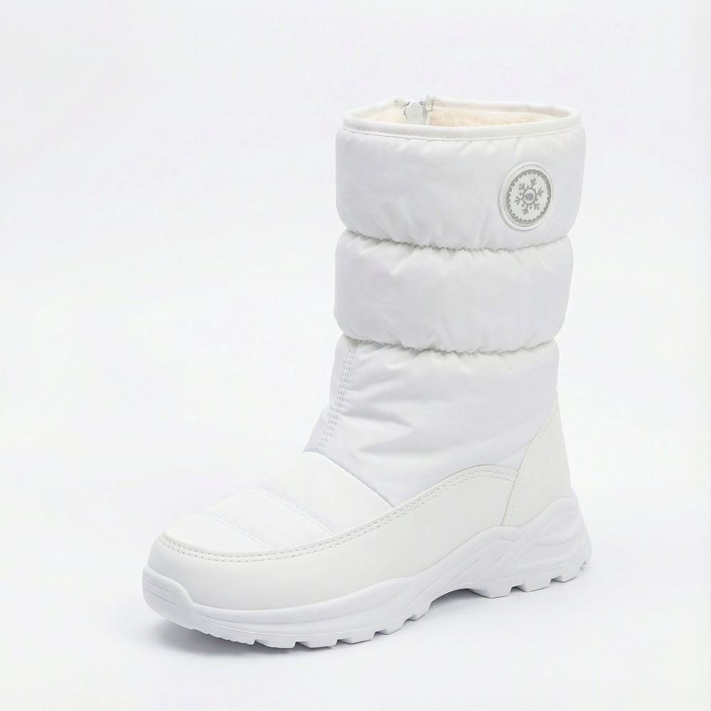White quilted pull on winter boot with a ridged white sole